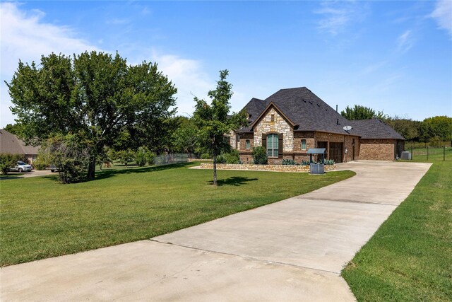 view of patio / terrace with ceiling fan and an outdoor stone fireplace