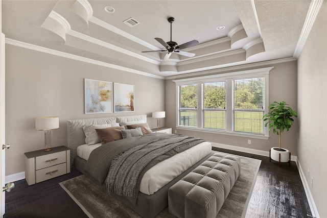 bedroom with ceiling fan, ornamental molding, a raised ceiling, and dark wood-type flooring