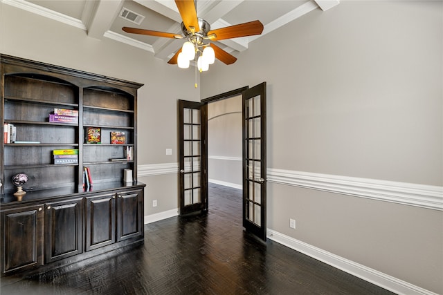 office with beamed ceiling, dark wood-type flooring, ornamental molding, ceiling fan, and french doors