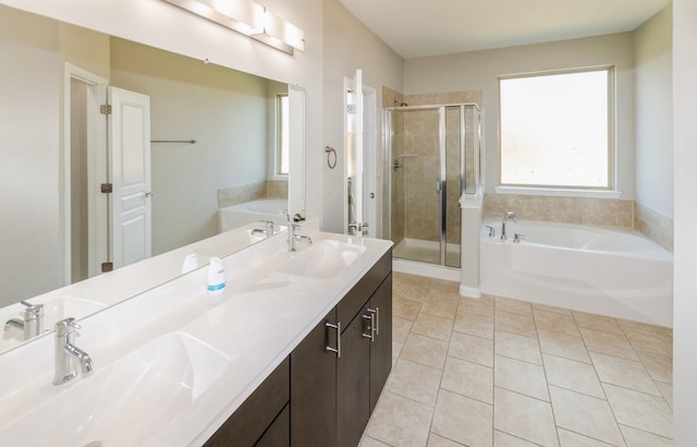 bathroom with vanity, plus walk in shower, and tile patterned flooring