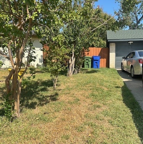 view of yard featuring a garage