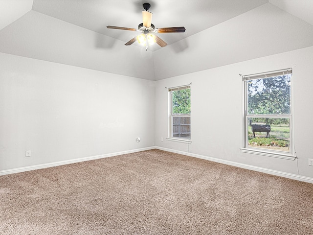 spare room with lofted ceiling, ceiling fan, and carpet floors