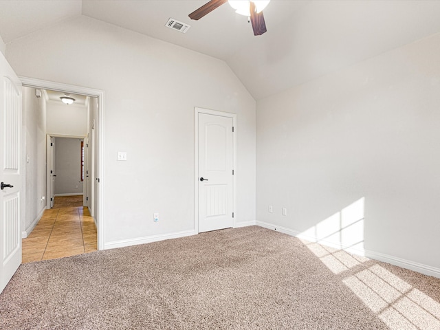 unfurnished bedroom with lofted ceiling, ceiling fan, and carpet floors