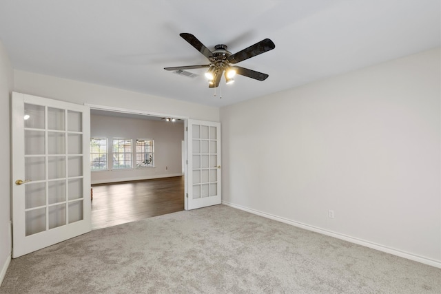 empty room featuring dark hardwood / wood-style floors and ceiling fan