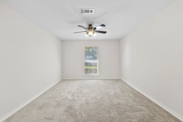 carpeted empty room with french doors and ceiling fan