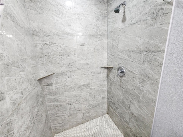 bathroom with tiled shower