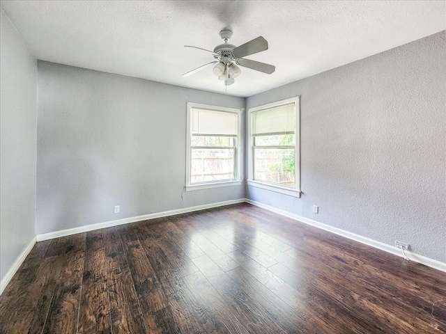 unfurnished room with dark hardwood / wood-style flooring, ceiling fan, and a textured ceiling