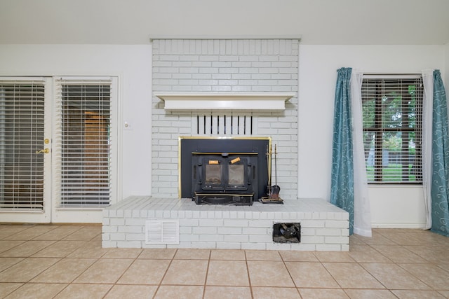 unfurnished living room with tile patterned flooring