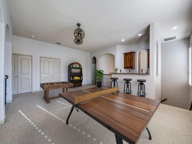 dining area with light colored carpet