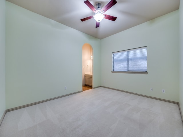 carpeted empty room with ceiling fan