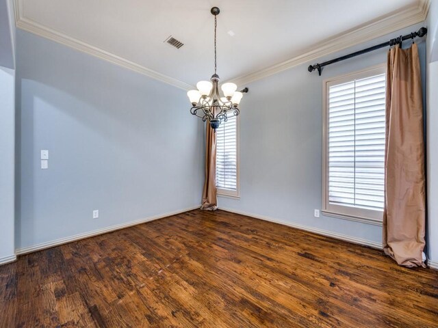 spare room featuring crown molding and a healthy amount of sunlight