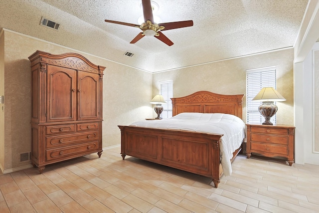 bedroom featuring multiple windows, ceiling fan, and light hardwood / wood-style flooring