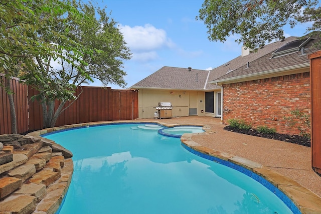 view of pool featuring an in ground hot tub and grilling area