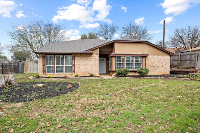 ranch-style home with a front yard