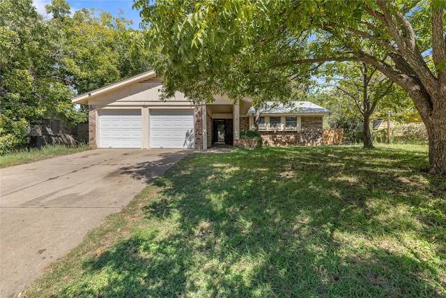 ranch-style house with a garage and a front yard