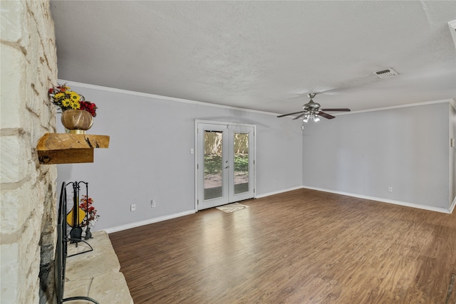 unfurnished living room featuring ceiling fan, crown molding, wood-type flooring, and a textured ceiling