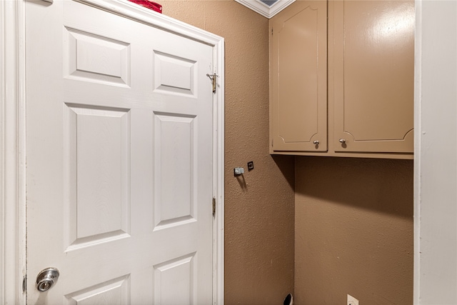 laundry room featuring cabinets