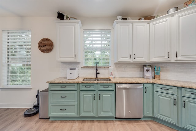 kitchen with dishwasher, light wood-type flooring, white cabinetry, and sink