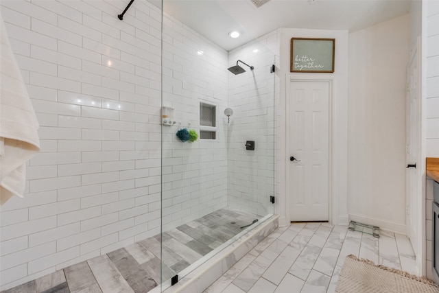 bathroom with tiled shower