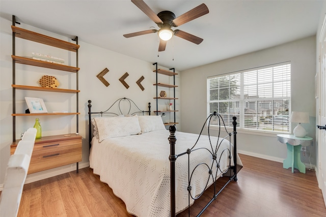 bedroom featuring ceiling fan and wood-type flooring