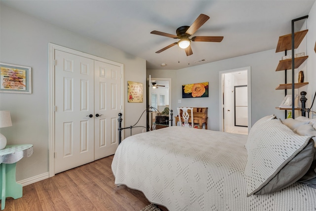 bedroom featuring a closet, ceiling fan, and light hardwood / wood-style floors