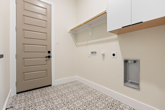 laundry area featuring cabinets and hookup for an electric dryer