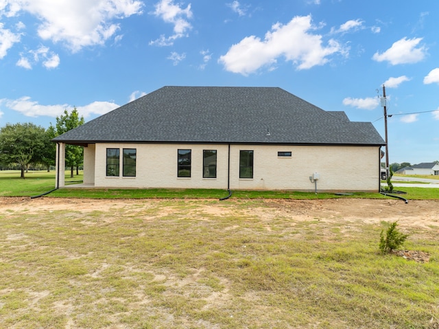 view of home's exterior featuring a yard and a patio area