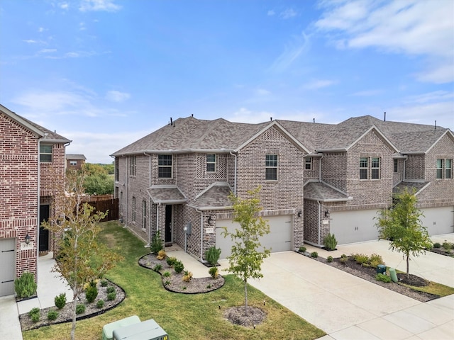 view of front of house with a garage and a front yard