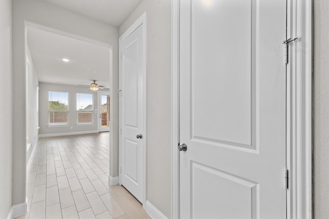 hallway featuring light tile patterned floors