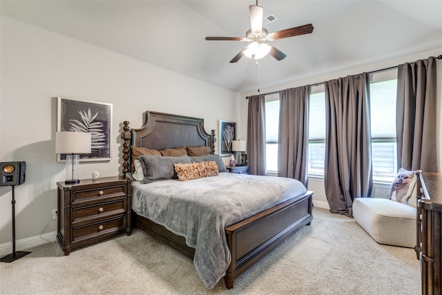 bedroom with light carpet, ceiling fan, and vaulted ceiling