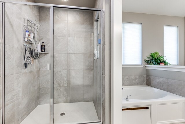 bathroom featuring plus walk in shower