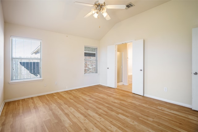 unfurnished room with lofted ceiling, light wood-type flooring, and ceiling fan