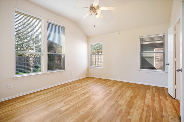 unfurnished room featuring lofted ceiling, light wood-type flooring, and ceiling fan