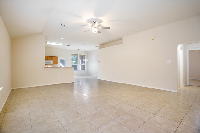 spare room with light tile patterned floors and ceiling fan