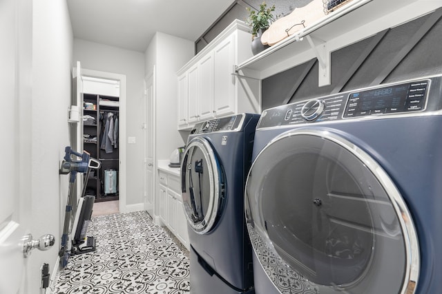 laundry room with cabinets and separate washer and dryer