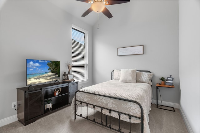 bedroom featuring vaulted ceiling, ceiling fan, and carpet floors