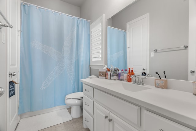 bathroom featuring tile patterned floors, toilet, curtained shower, and vanity