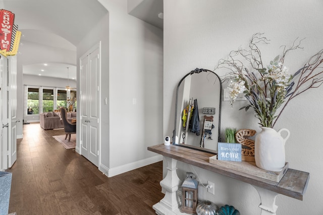 hall with dark wood-type flooring