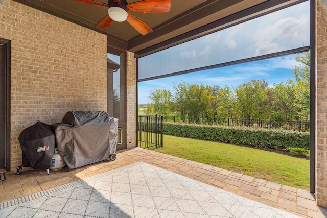 interior space with a grill and ceiling fan