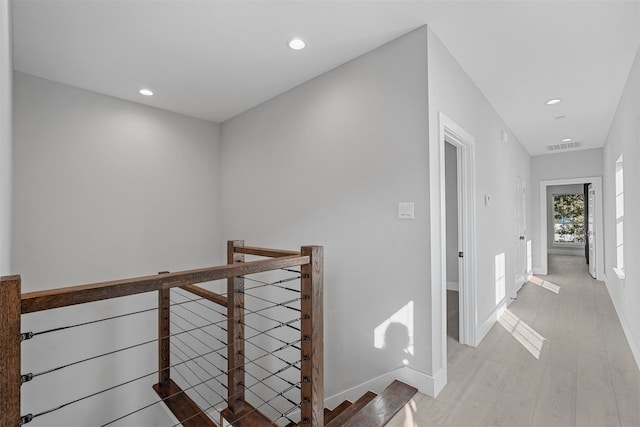 hallway with light wood-type flooring