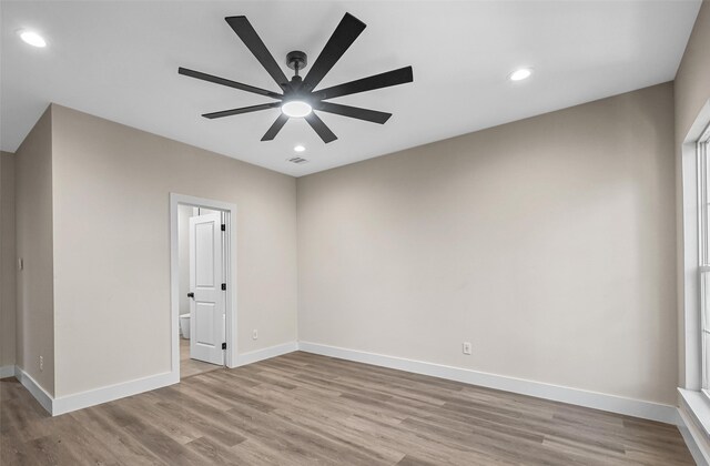 spare room with ceiling fan and light hardwood / wood-style flooring