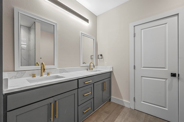 bathroom with hardwood / wood-style flooring and vanity