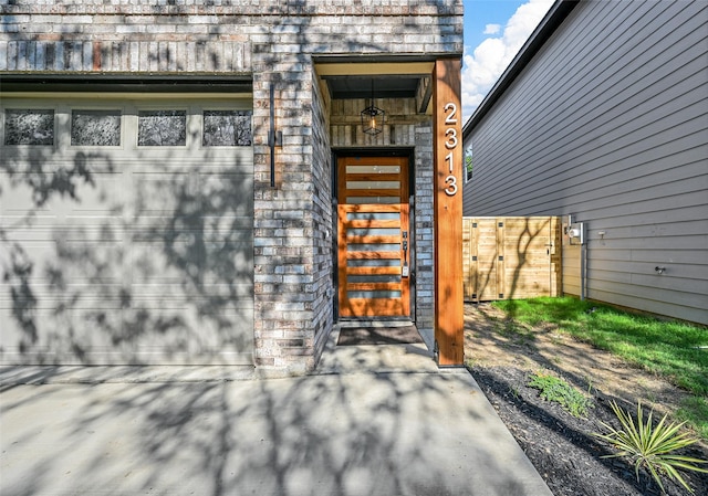 view of exterior entry featuring a garage