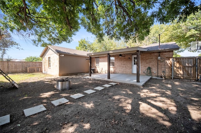 back of house with a patio