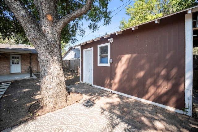 view of property exterior with a patio