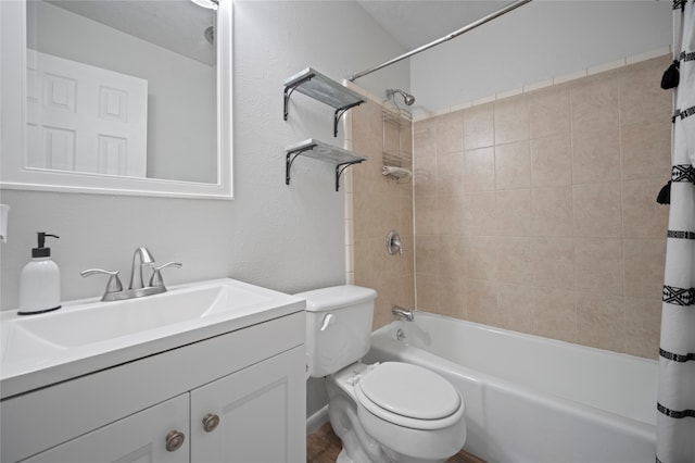 full bathroom with shower / bath combo, vanity, and toilet