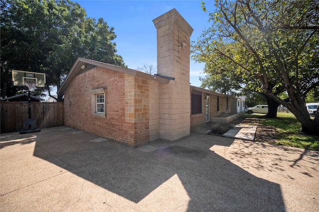 view of home's exterior with a patio area