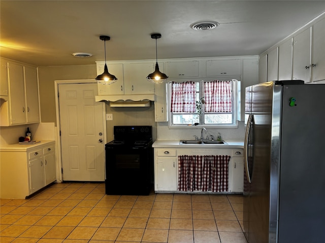 kitchen featuring white cabinets, hanging light fixtures, electric range, sink, and stainless steel fridge