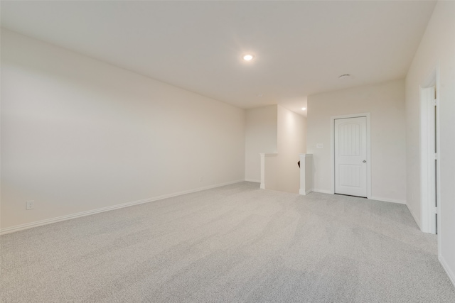 spare room with light colored carpet