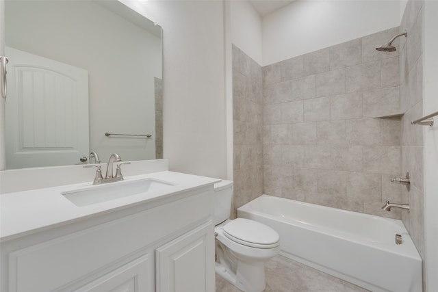 full bathroom with vanity, tiled shower / bath combo, and toilet